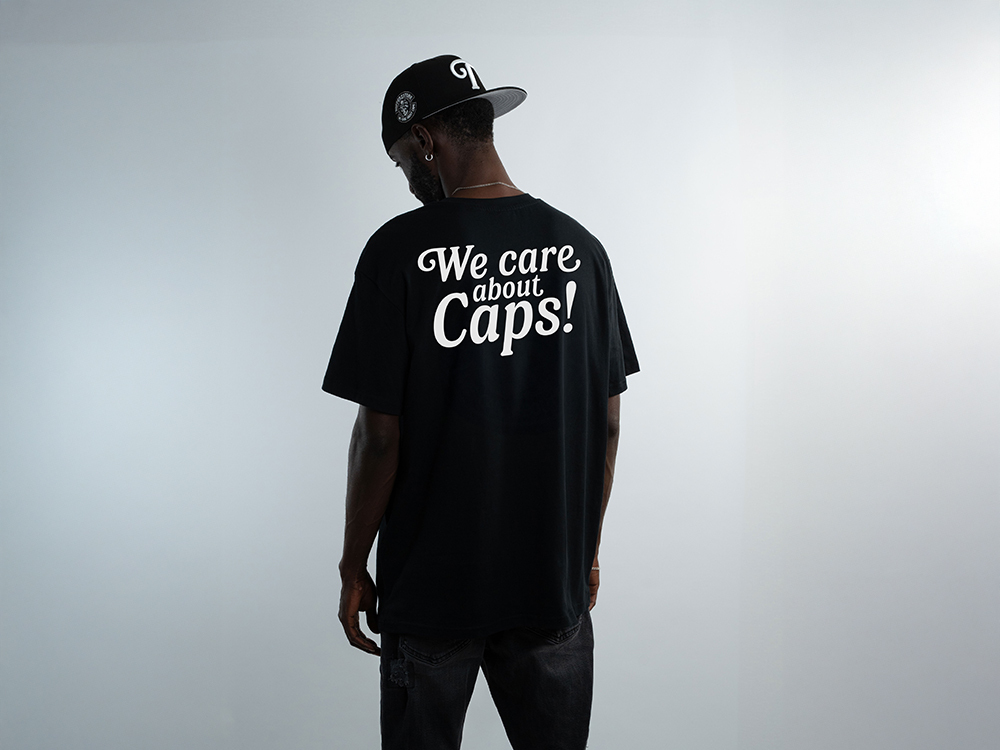 Family T-Shirt We Care About Caps Black Oversize Edition